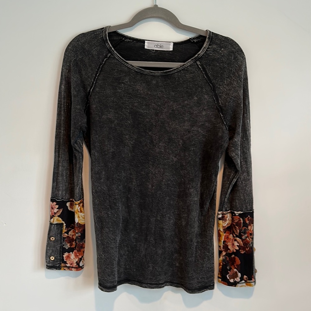 Super soft long sleeve top with floral cuffs and wood button detail.  Size M